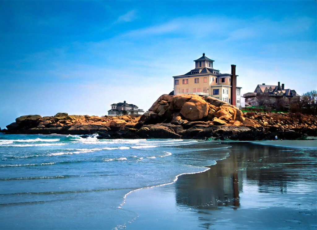 Service Center - Scenic View of Multiple Story Homes on a Rocky Cliff by the Coast in New England Massachusetts Against a Bright Blue Sky